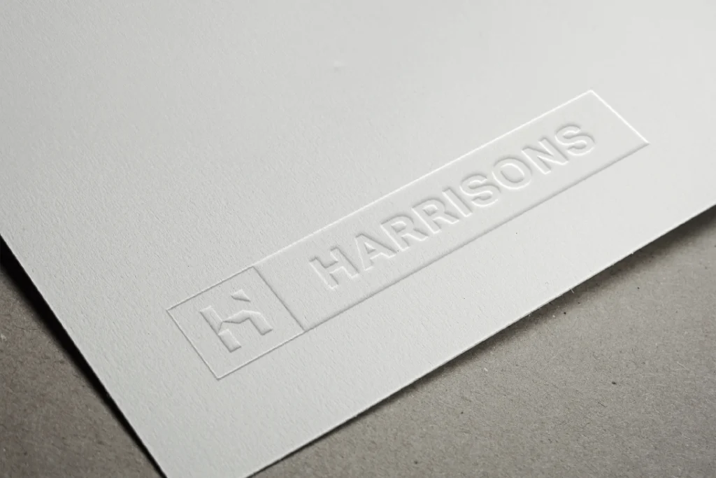 Harrisons Logo embossed on paper